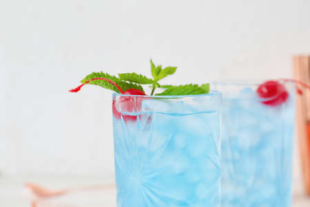 Glasses of Blue  cocktail on light background, closeupの写真素材