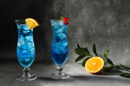Glasses of Blue  cocktail on dark backgroundの写真素材