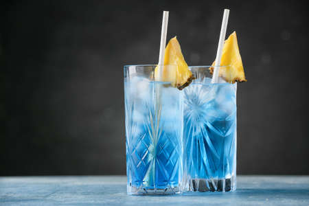 Glasses of Blue cocktail on tableの写真素材