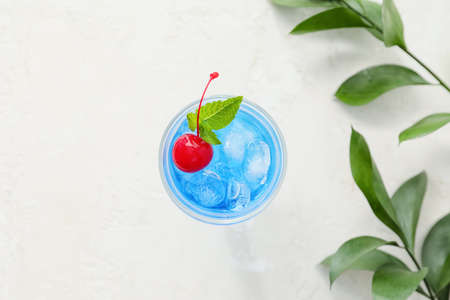 Glass of Blue cocktail on light backgroundの写真素材