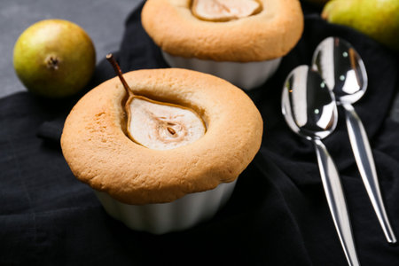 Tasty pear pot pies on dark backgroundの写真素材