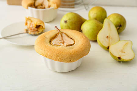 Tasty pear pot pie on light wooden backgroundの写真素材