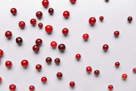 Tasty fresh cranberries on light backgroundの写真素材