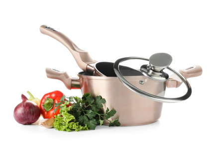 Cooking pot and pan with vegetables on white backgroundの写真素材