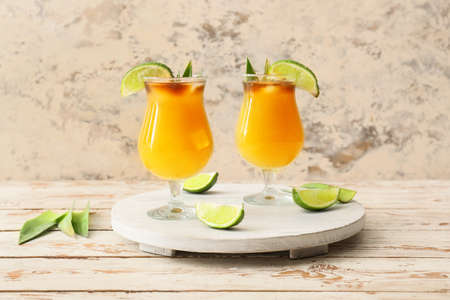 Glasses of tasty mai tai cocktail on tableの写真素材