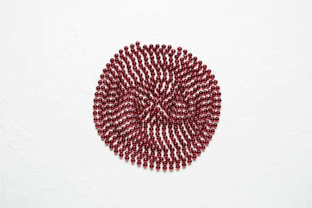 Japanese flag concept. Beads on white background