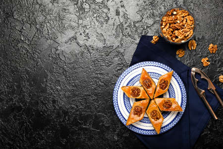 Plate with tasty baklava on dark backgroundの写真素材