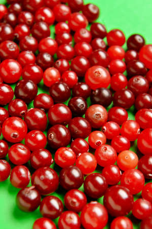 Healthy cranberries on color background, closeup