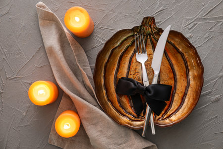 Halloween table setting with candles on grunge backgroundの写真素材