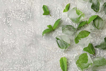 Ice cubes with mint and lime on gray backgroundの写真素材