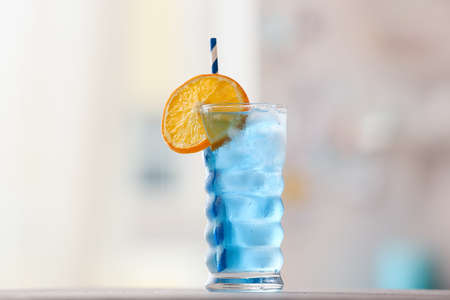 Glass of Blue Lagoon cocktail on table