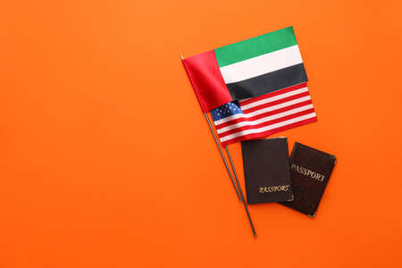 National UAE, USA flags and passports on red backgroundの写真素材