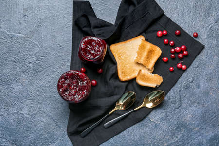 Composition with toasts, berries and cranberry jam on dark backgroundの写真素材