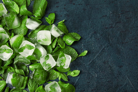 Ice cubes and mint leaves on dark backgroundの写真素材