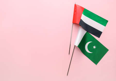 National UAE and Pakistan flags on pink backgroundの写真素材