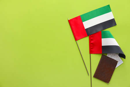 Flags of United Arab Emirates and passport on green backgroundの写真素材