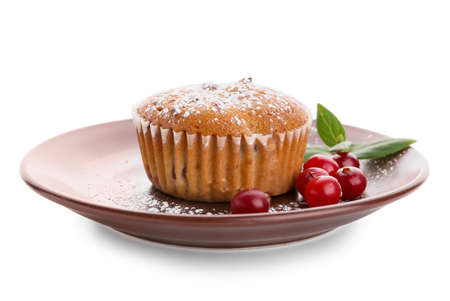 Plate with tasty cranberry muffin on white backgroundの写真素材