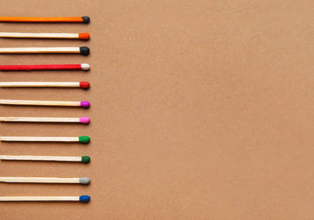 Different new matchsticks on brown backgroundの写真素材