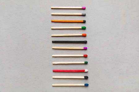 Different new matchsticks on gray background