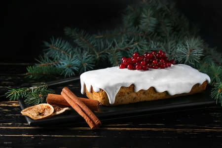 Tray with tasty Christmas bread on table