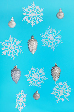 Christmas balls with snowflakes on blue background