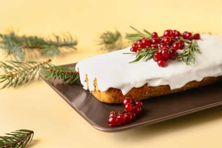 Plate with tasty Christmas bread on table