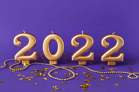 Figure 2022 with beads and confetti on purple backgroundの写真素材