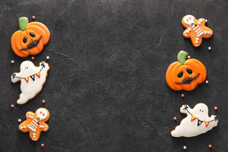 Tasty cookies for Halloween celebration on dark backgroundの写真素材
