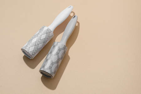 New lint rollers on beige background