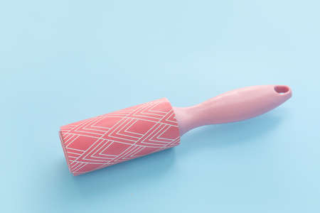 New lint roller on blue background