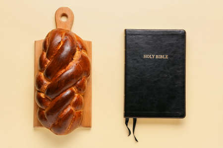 Traditional challah bread with Tanakh on light background. Shabbat Shalomの写真素材