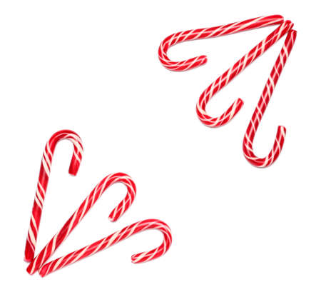 Tasty candy canes on white background
