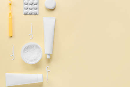 Set of dental hygiene on beige background