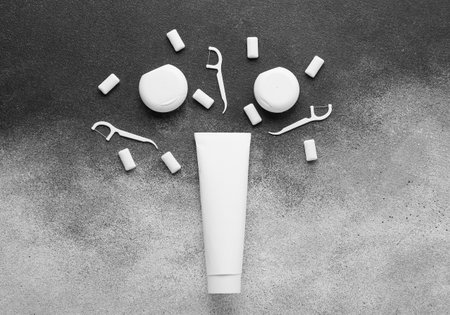 Composition with set of dental hygiene on gray background