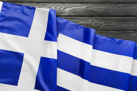 National Greece flag on black wooden backgroundの写真素材