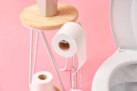 Holder with roll of soft toilet paper on color background, closeupの写真素材
