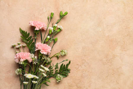 Beautiful flowers on beige background, closeupの写真素材