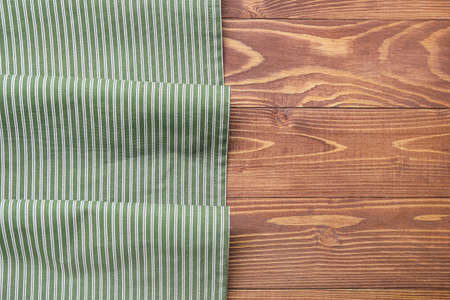 New napkin for picnic on wooden background