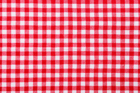 Red checkered tablecloth for picnic as background