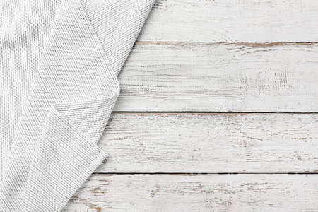 New napkin for picnic on white wooden background