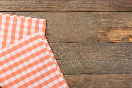 New checkered napkins for picnic on wooden backgroundの写真素材