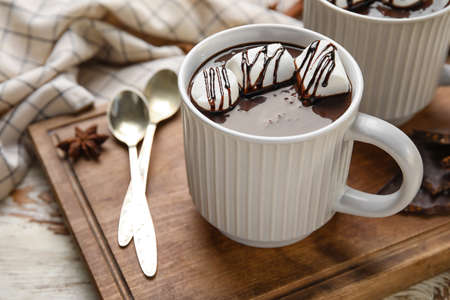 Cup of tasty hot chocolate with marshmallow on tableの写真素材