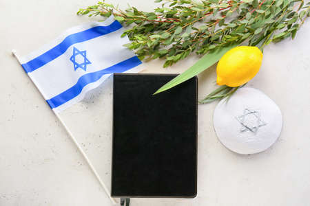 Sukkot festival symbols, Bible and flag of Israel on light backgroundの写真素材