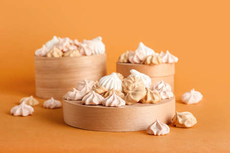 Delicious mini meringue on color backgroundの写真素材