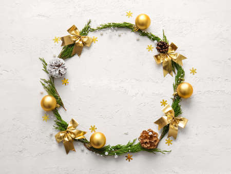 Frame made of coniferous branches and Christmas decor on white backgroundの写真素材