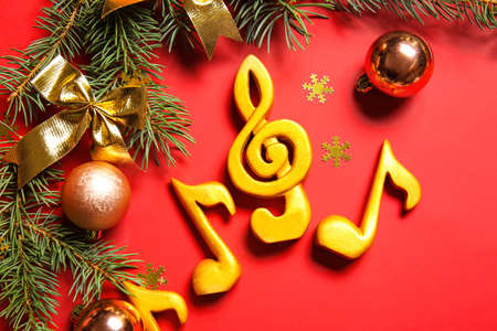 Note signs with Christmas decor and fir branches on red background, closeupの写真素材