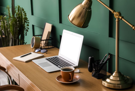 Modern workplace with laptop in roomの写真素材