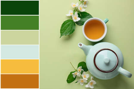 Cup of jasmine tea, teapot and flowers on table. different color patternsの写真素材