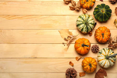 Autumn composition with pumpkins on wooden background, closeupの写真素材