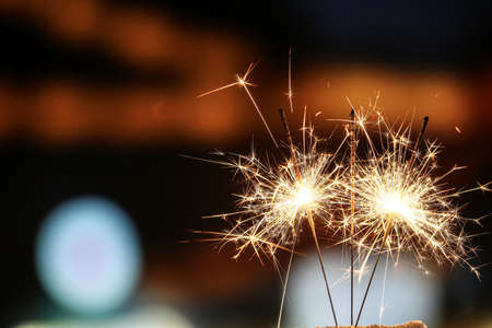 Beautiful sparklers at night outdoorsの写真素材